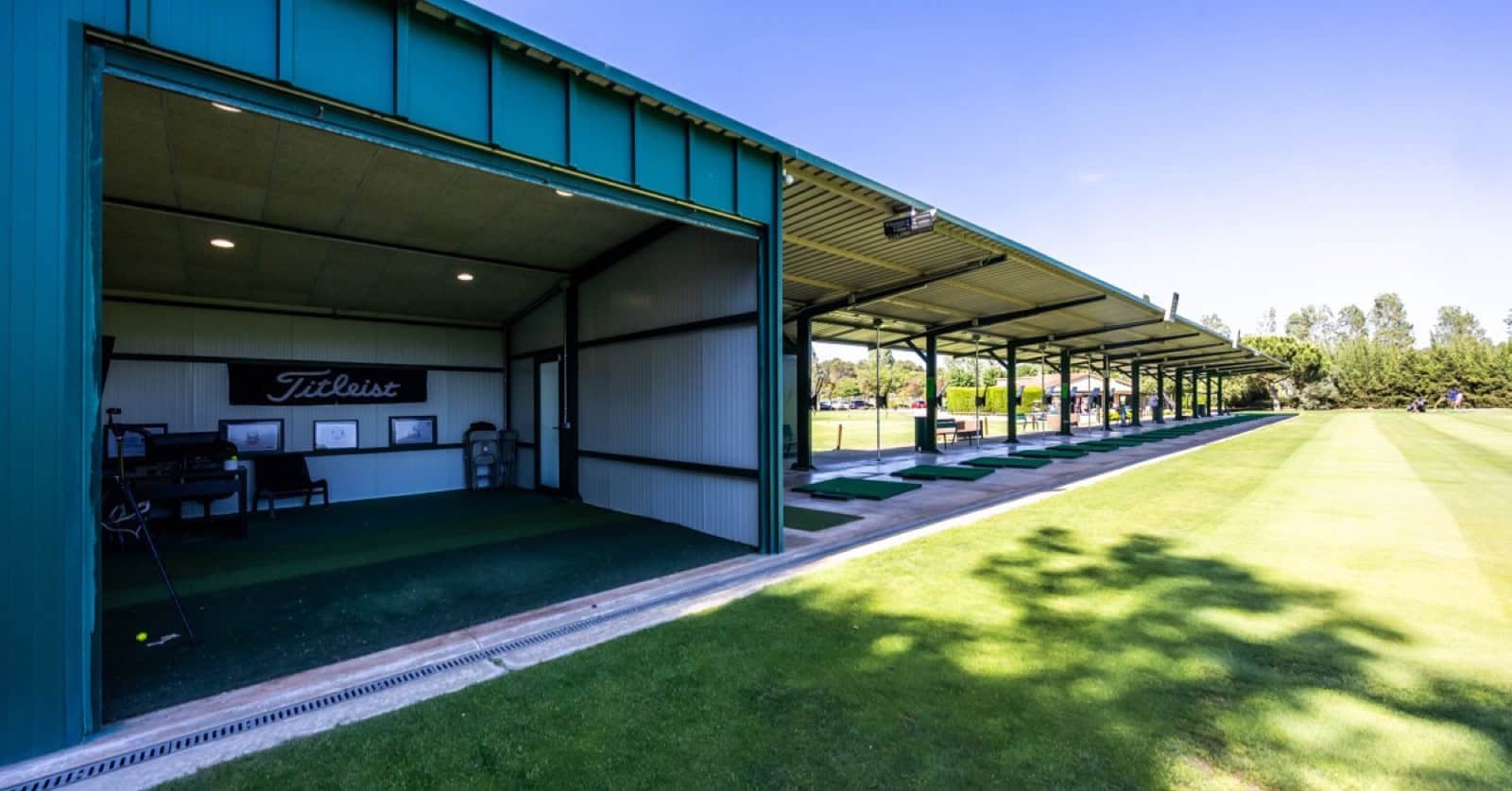 Covered bays on the driving range at La Roca Golf next to the Swing Lab room, where club fitting takes place.